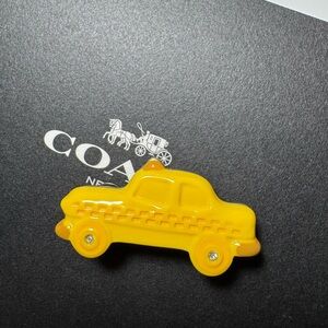 Coach crystal taxi pin